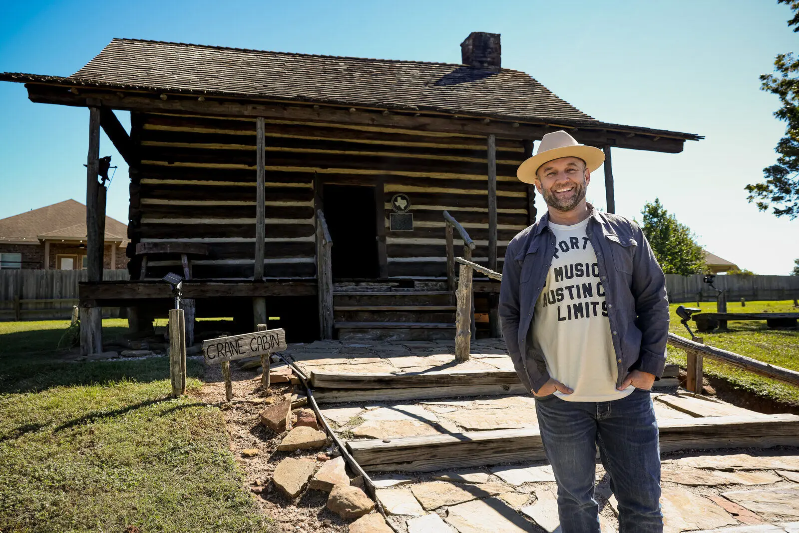 Chet Garner at a historic log cabin at Fernland Historical Park, Montgomery, Texas