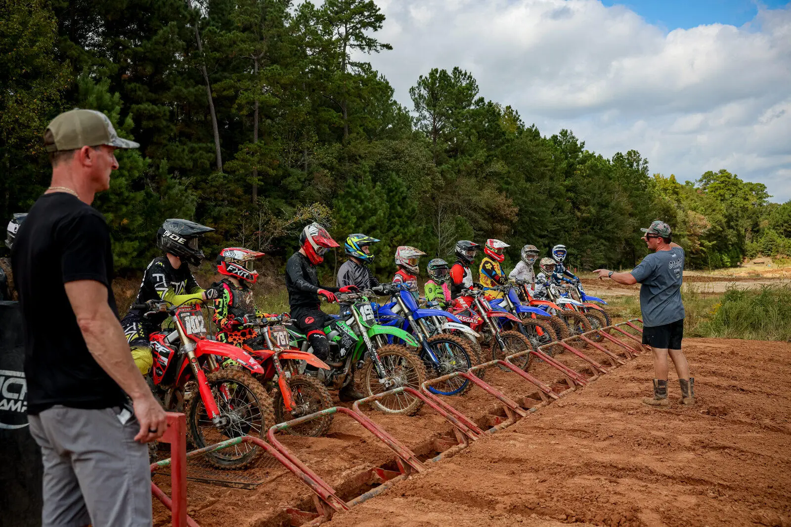 Motocross riders lined up at the starting gate at Texas Tornado Boot Camp